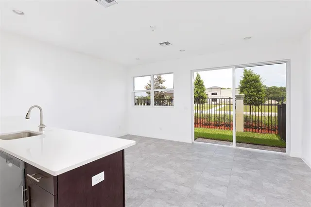 a kitchen with a sink and a night stand