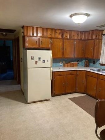 14 Lawrence Road Haverhill, MA 01835 - Photo 5 of 14 a kitchen with a refrigerator and a sink