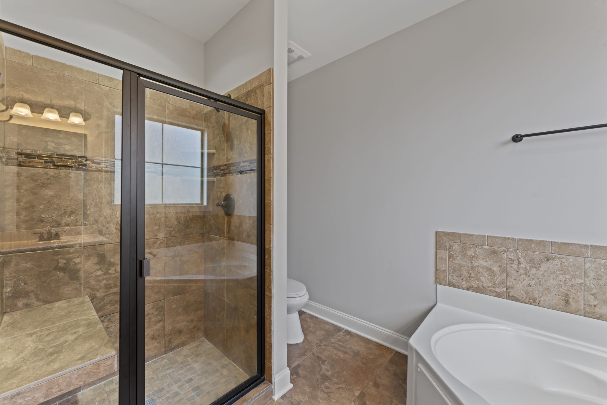 2314 Tranquility Trail Smyrna, TN 37167 - Photo 14 of 35 a bathroom with a tub and shower