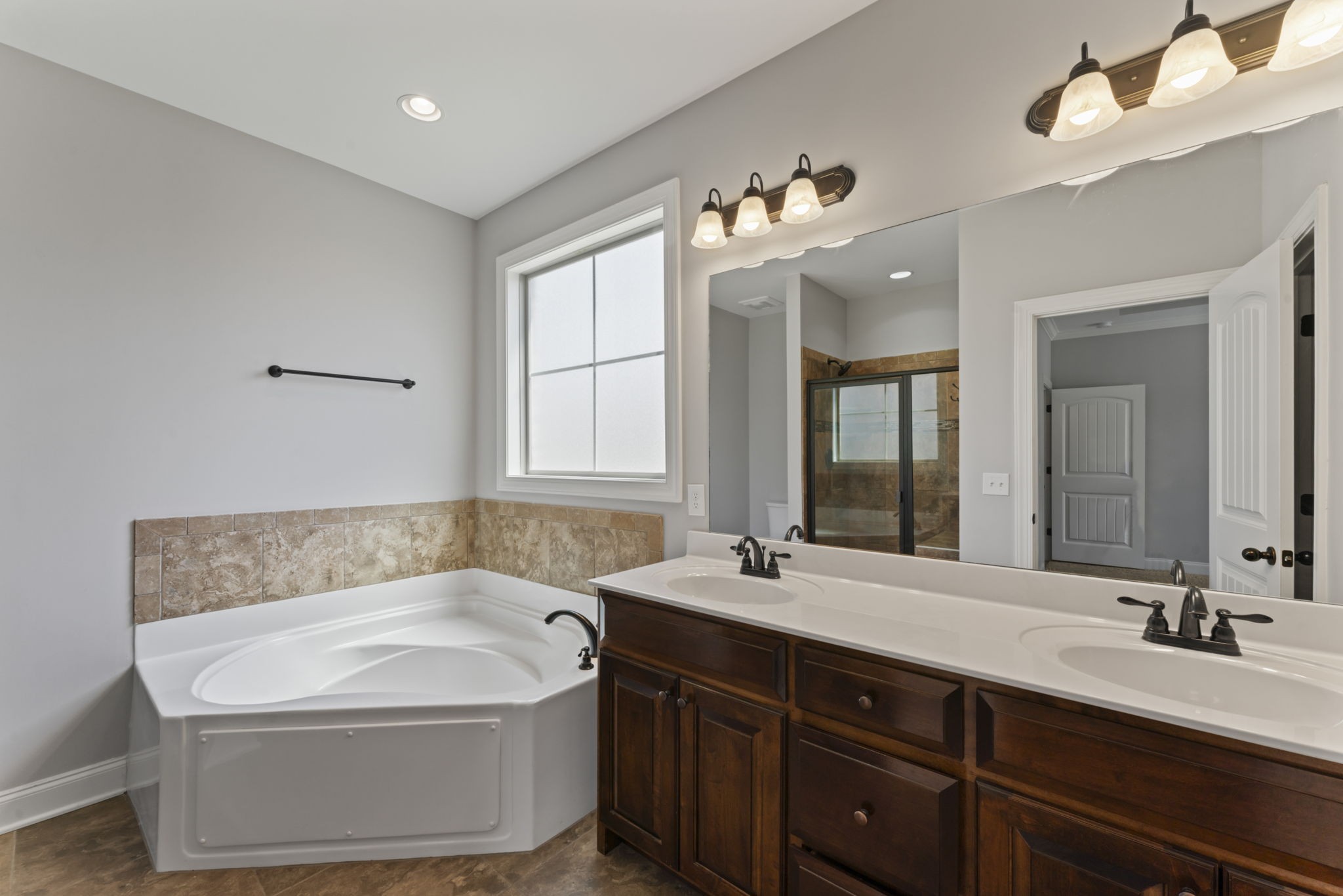 2314 Tranquility Trail Smyrna, TN 37167 - Photo 15 of 35 a bathroom with a tub sink and mirror
