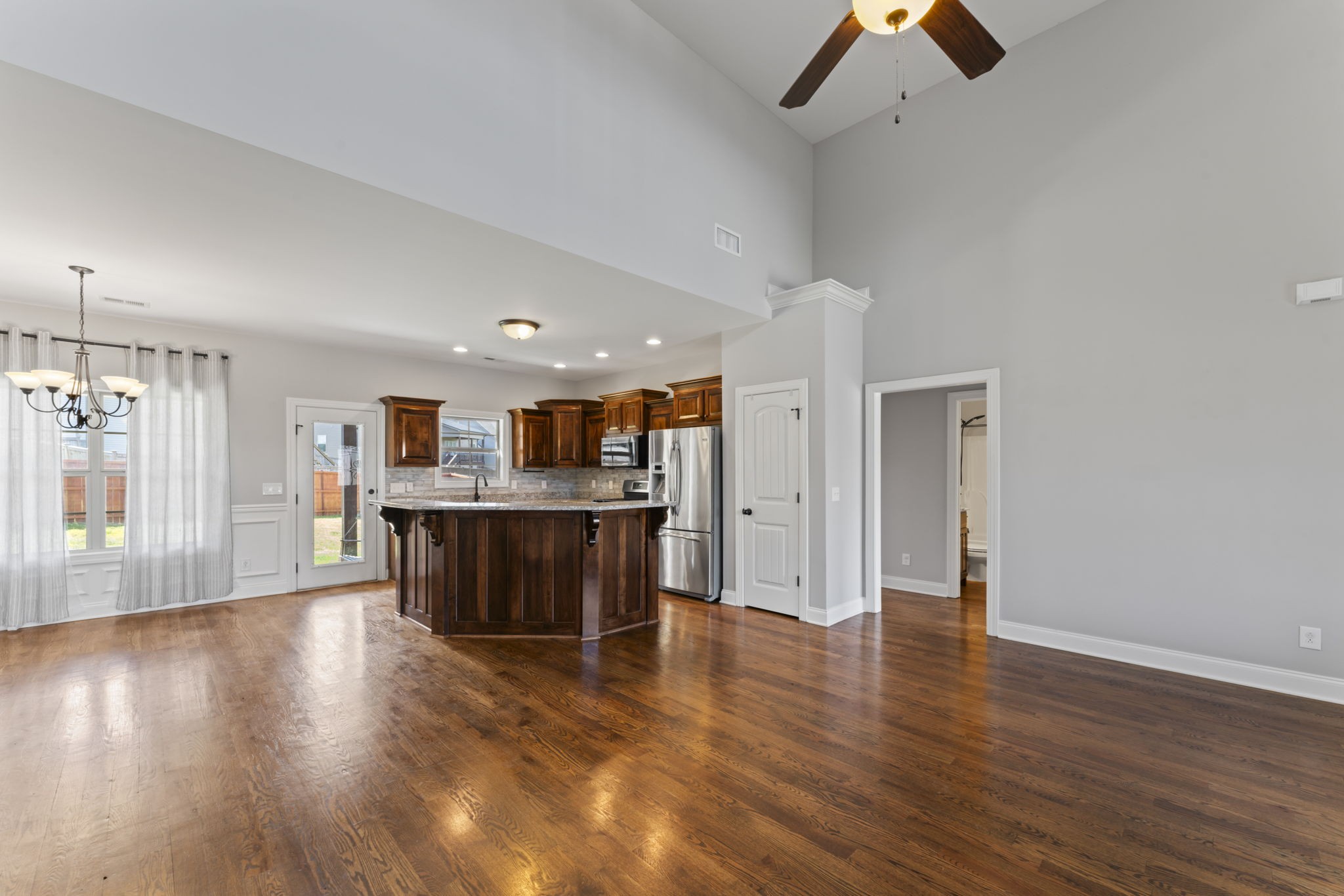 2314 Tranquility Trail Smyrna, TN 37167 - Photo 7 of 35 a view of a room with wooden floor and a ceiling fan