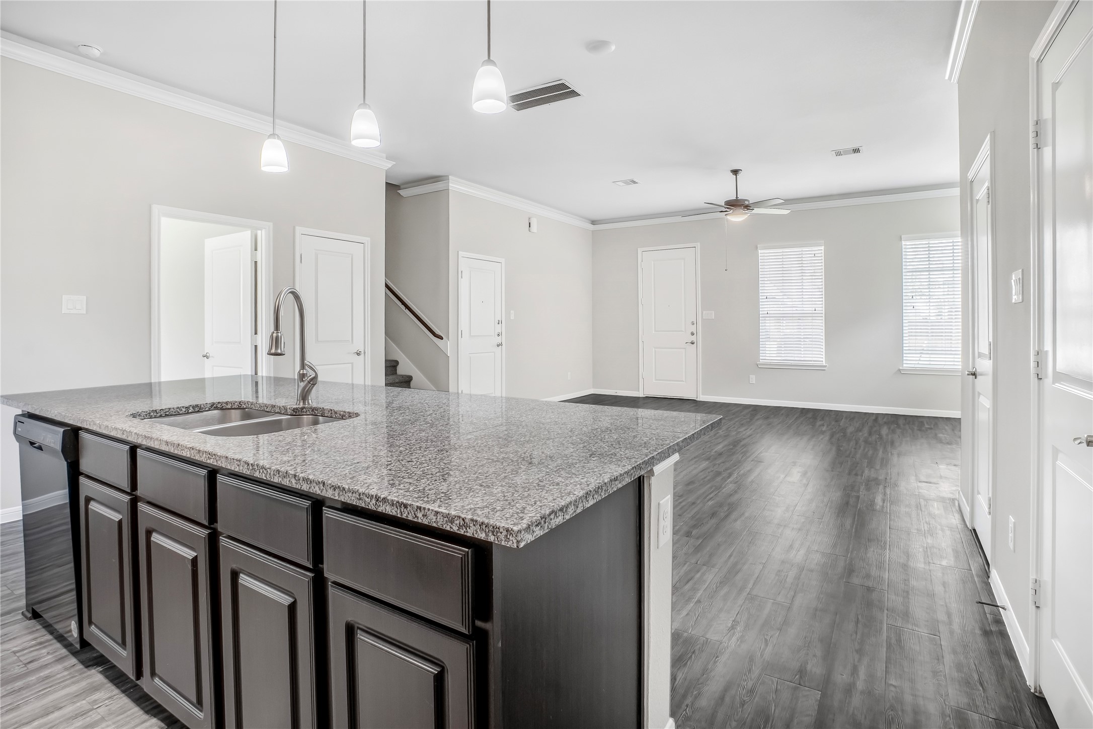 6532 Geisler Crossing Lane League City, TX 77539 - Photo 11 of 28 a kitchen with sink cabinets and wooden floor