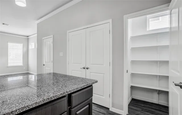 a kitchen with a sink and cabinets