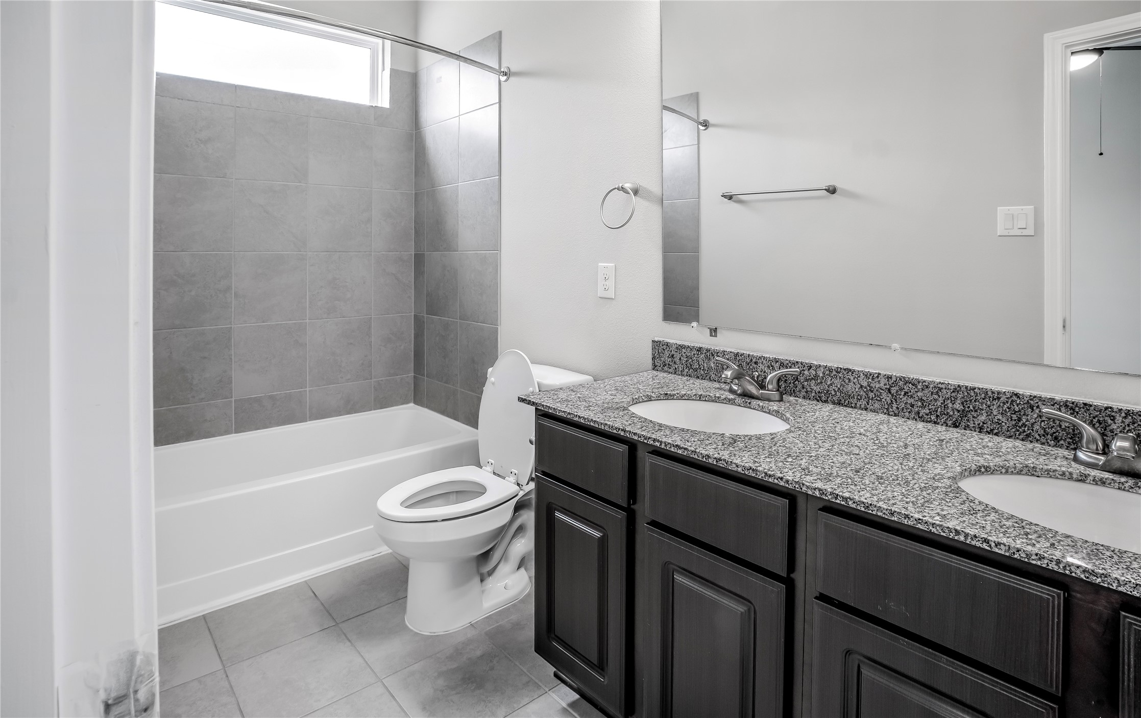 6532 Geisler Crossing Lane League City, TX 77539 - Photo 17 of 28 a bathroom with a granite countertop sink a toilet a mirror and bathtub