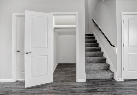 a view of an empty room and closet