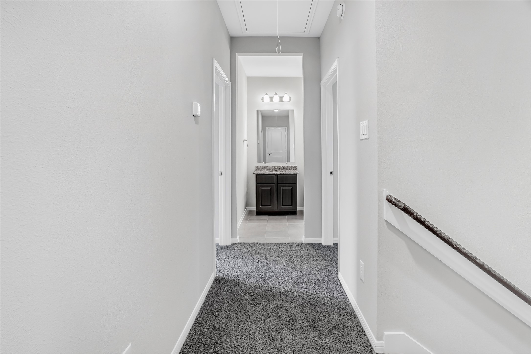 6532 Geisler Crossing Lane League City, TX 77539 - Photo 21 of 28 a view of a hallway with wooden shelves