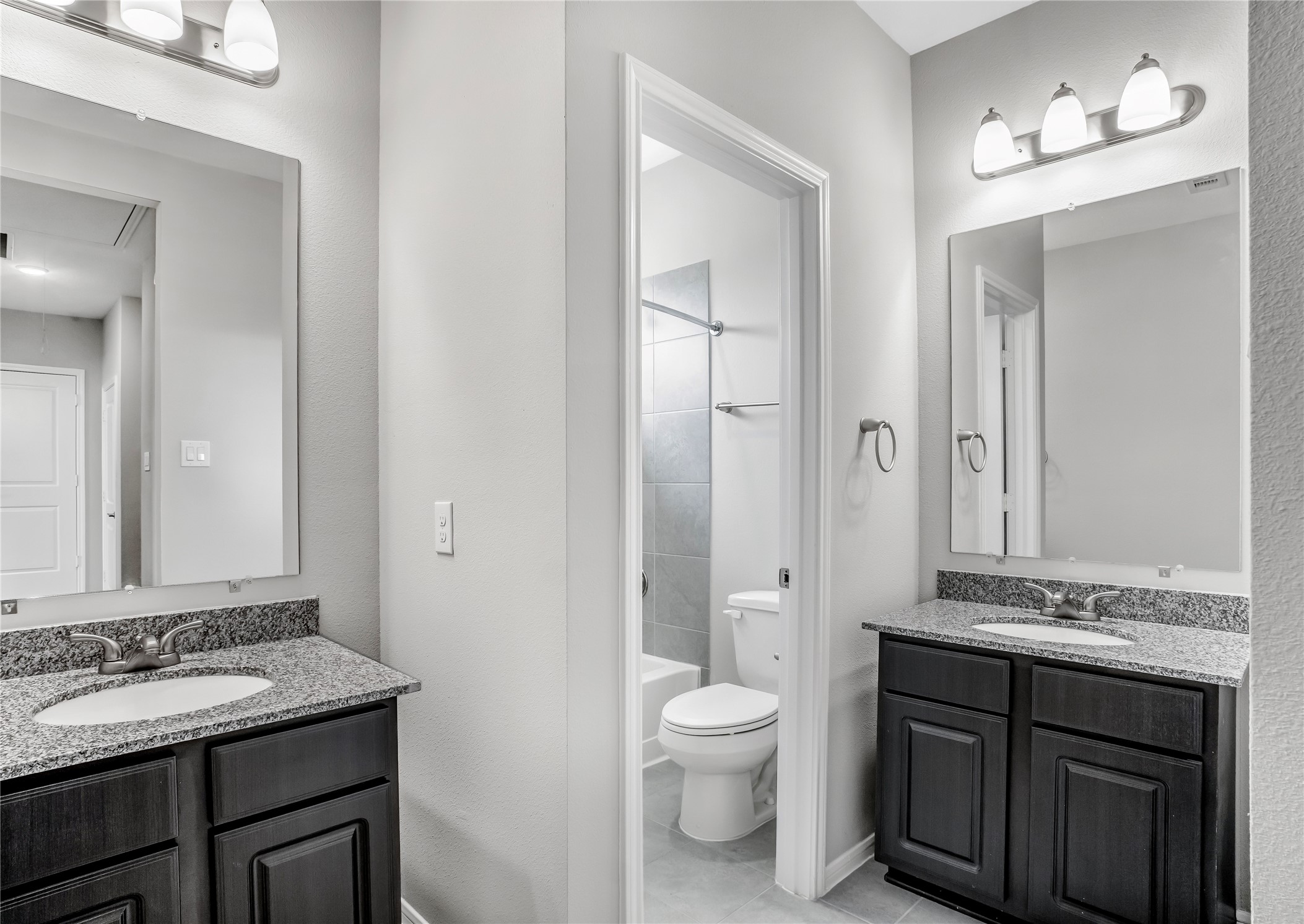 6532 Geisler Crossing Lane League City, TX 77539 - Photo 24 of 28 a bathroom with a granite countertop sink toilet and shower