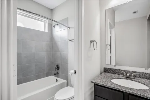 a view of an empty room and closet area