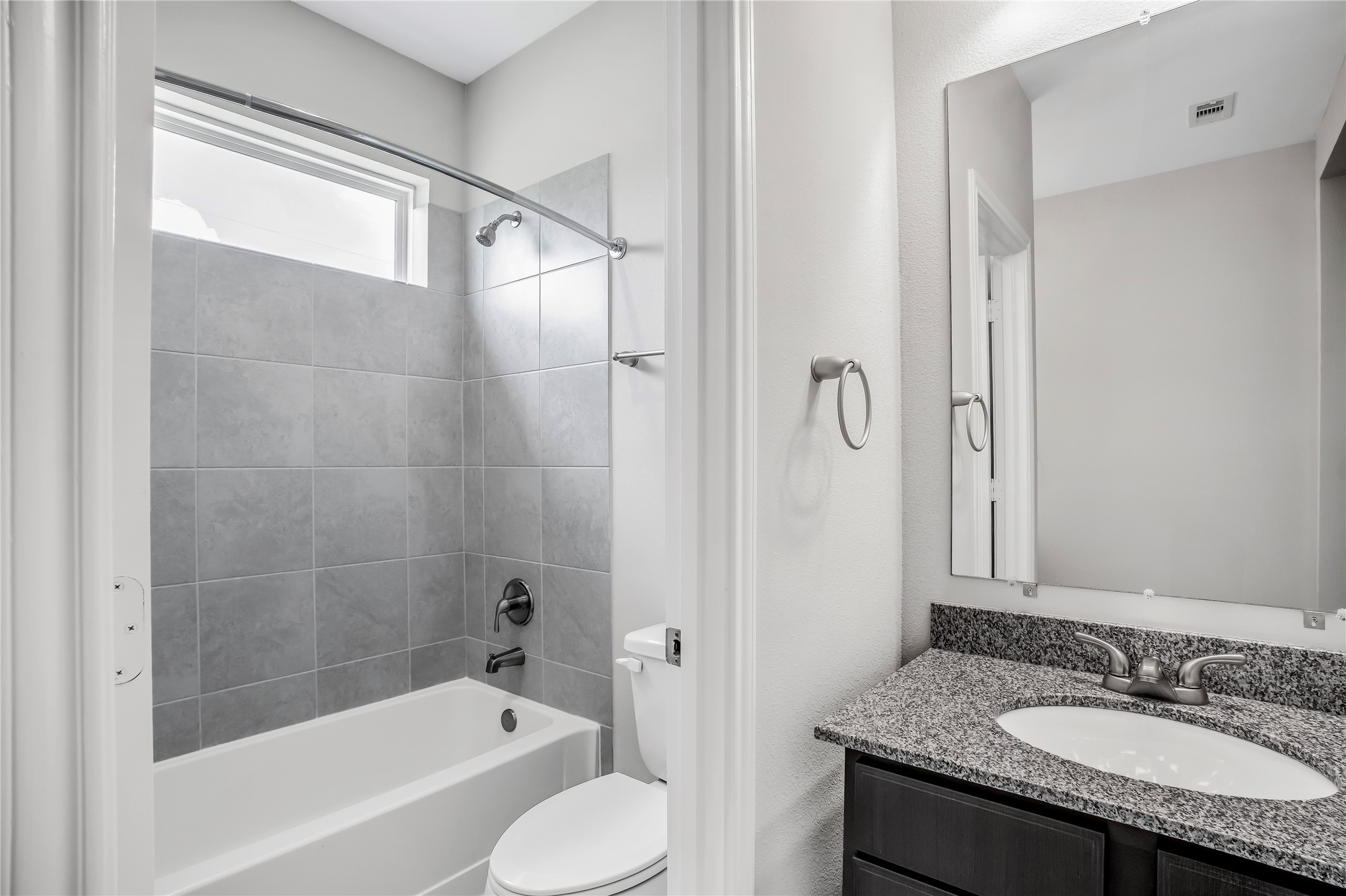 6532 Geisler Crossing Lane League City, TX 77539 - Photo 25 of 28 a bathroom with a granite countertop tub sink shower and a mirror