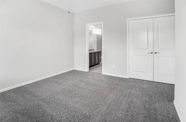 a bathroom with a granite countertop tub sink and mirror