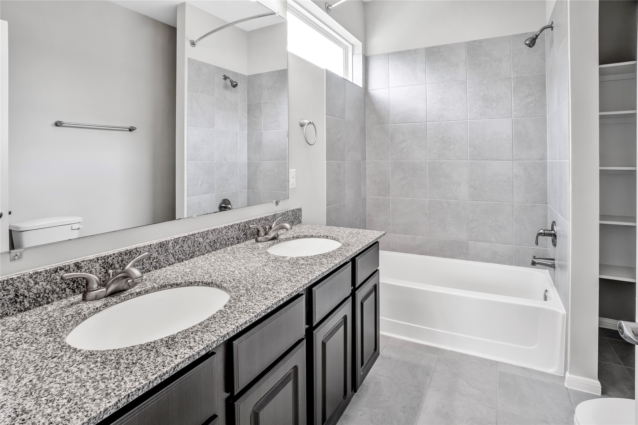 6532 Geisler Crossing Lane League City, TX 77539 - Photo 27 of 28 a bathroom with a granite countertop tub sink and mirror
