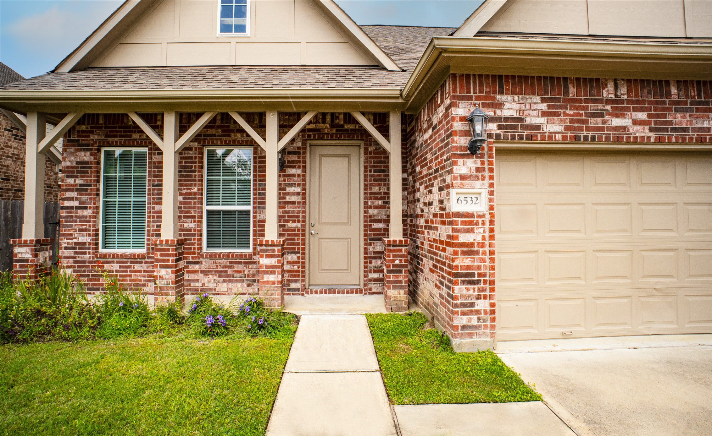 6532 Geisler Crossing Lane League City, TX 77539 - Photo 3 of 28 a front view of a house with garden