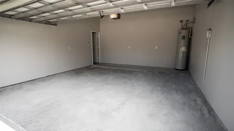 a view of a kitchen with wooden floor and a ceiling fan