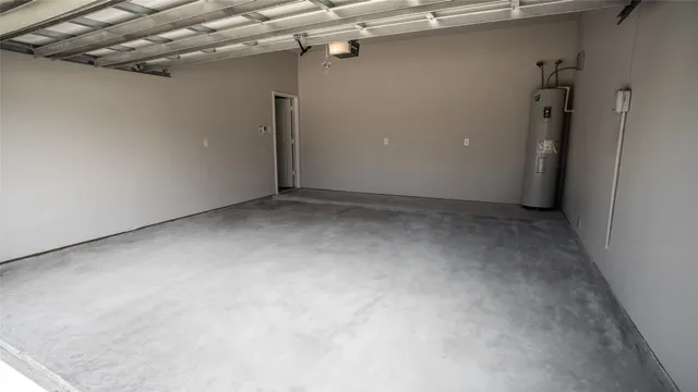 a view of a kitchen with wooden floor and a ceiling fan