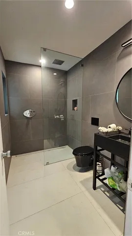 a bed room with a large bed and window