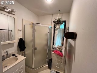 33145 Southeast Compton Road Boring, OR 97009 - Photo 14 of 17 a bathroom with a sink mirror and shower