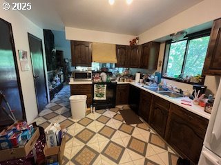 33145 Southeast Compton Road Boring, OR 97009 - Photo 17 of 17 a kitchen with a sink appliances and cabinets
