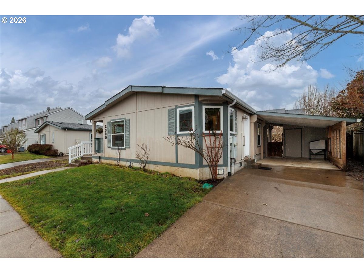 2329 North Gray Street Cornelius, OR 97113 - Photo 1 of 27 a front view of a house with a garden