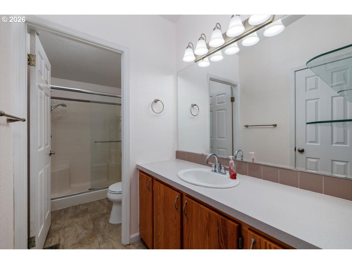 2329 North Gray Street Cornelius, OR 97113 - Photo 19 of 27 a bathroom with a sink and a mirror