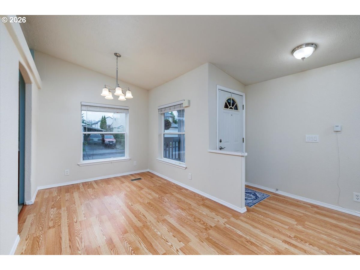2329 North Gray Street Cornelius, OR 97113 - Photo 5 of 27 a view of an empty room with window and wooden floor