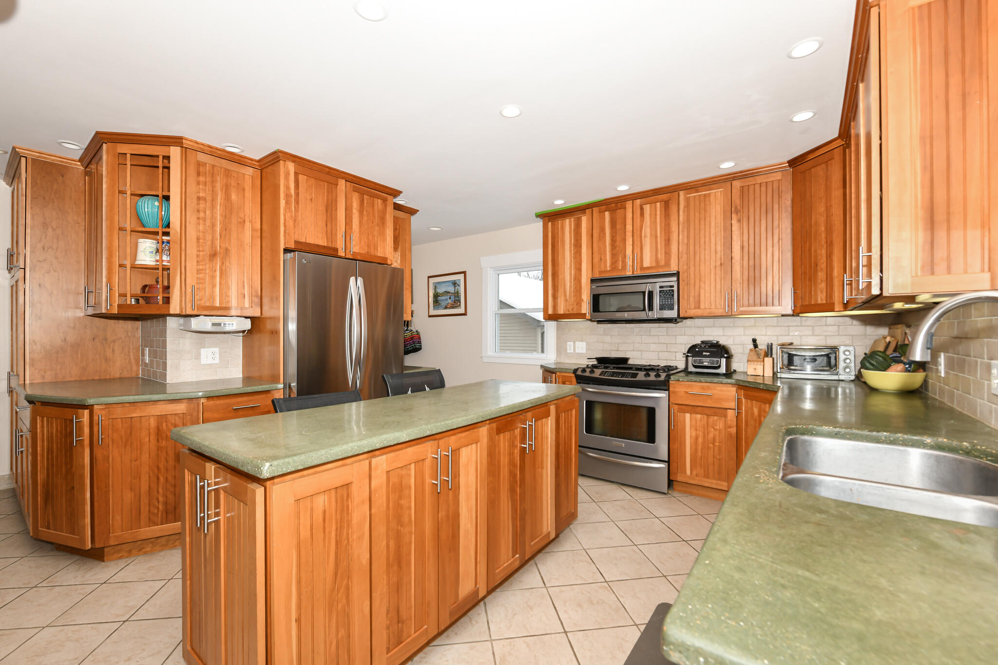 4222 Maple Drive Delavan, WI 53115 - Photo 4 of 38 Spacious island boasts more storage plus electricity for your mix master, smoothie maker, etc.