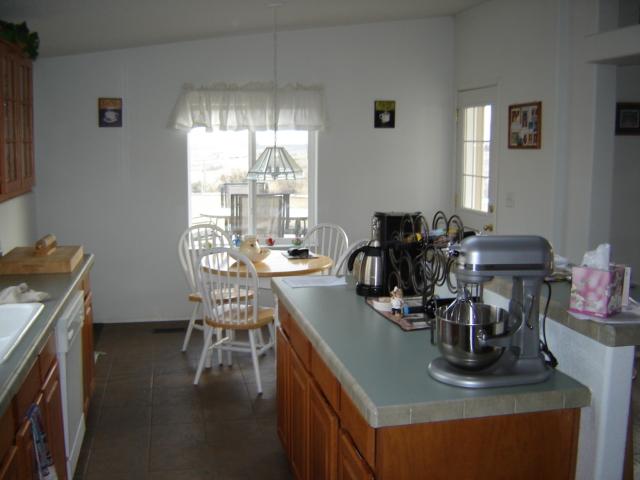 15240 Fisk Road Yakima, WA 98908 - Photo 7 of 13 a view of a dining room with furniture and wooden floor