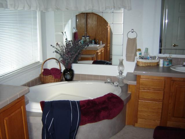 15240 Fisk Road Yakima, WA 98908 - Photo 9 of 13 a bathroom with a sink and a mirror