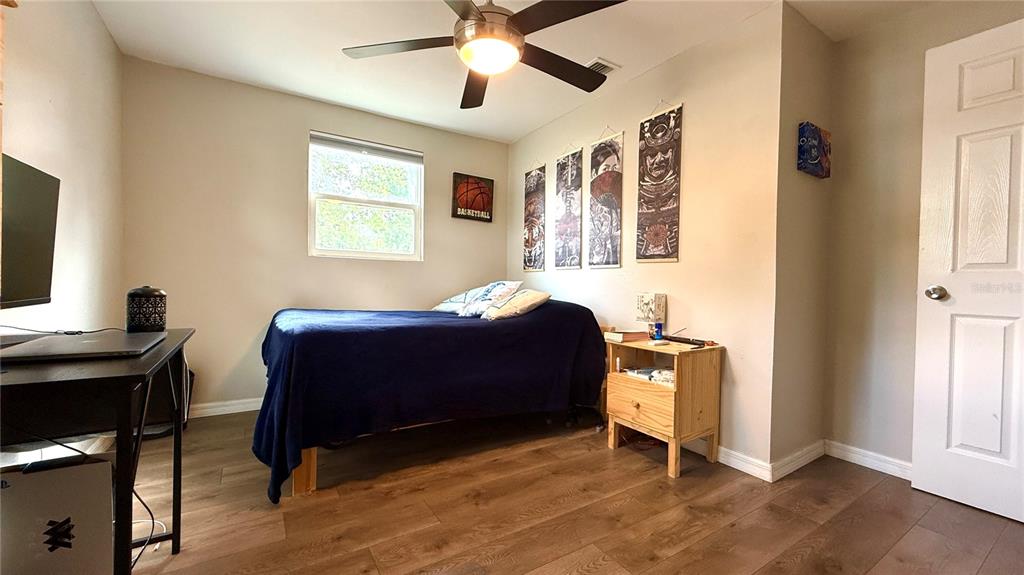 111 Palencia Road Auburndale, FL 33823 - Photo 11 of 28 a bedroom with a bed and a window