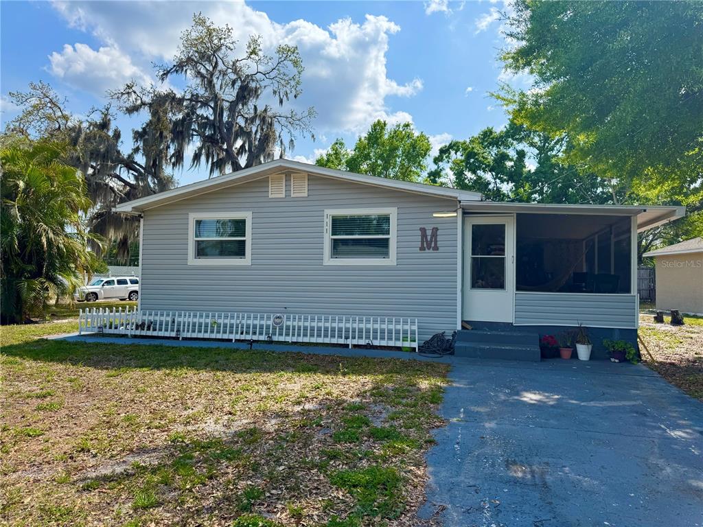 111 Palencia Road Auburndale, FL 33823 - Photo 19 of 28 a view of a house with a yard
