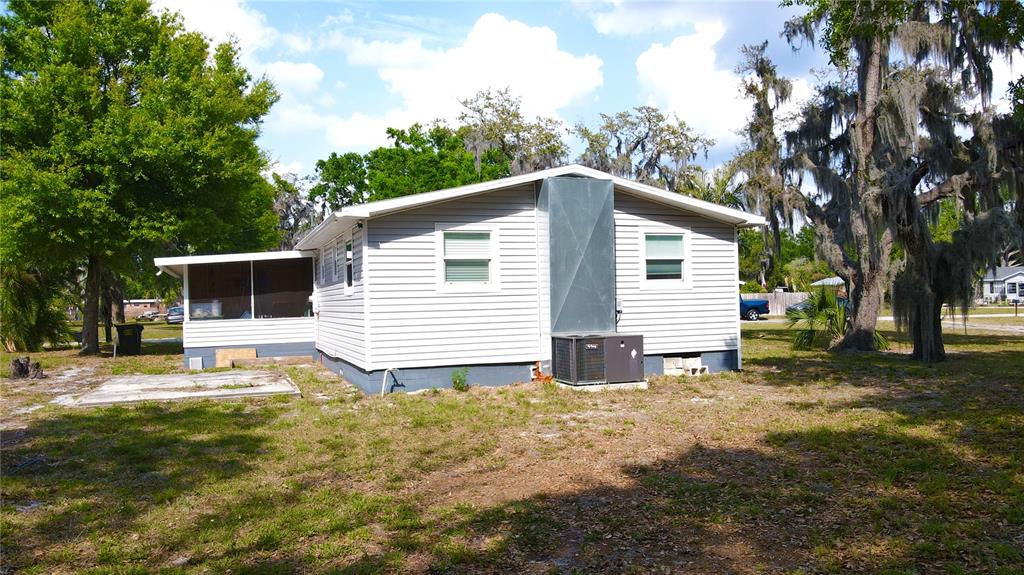 111 Palencia Road Auburndale, FL 33823 - Photo 20 of 28 a view of a house with a yard