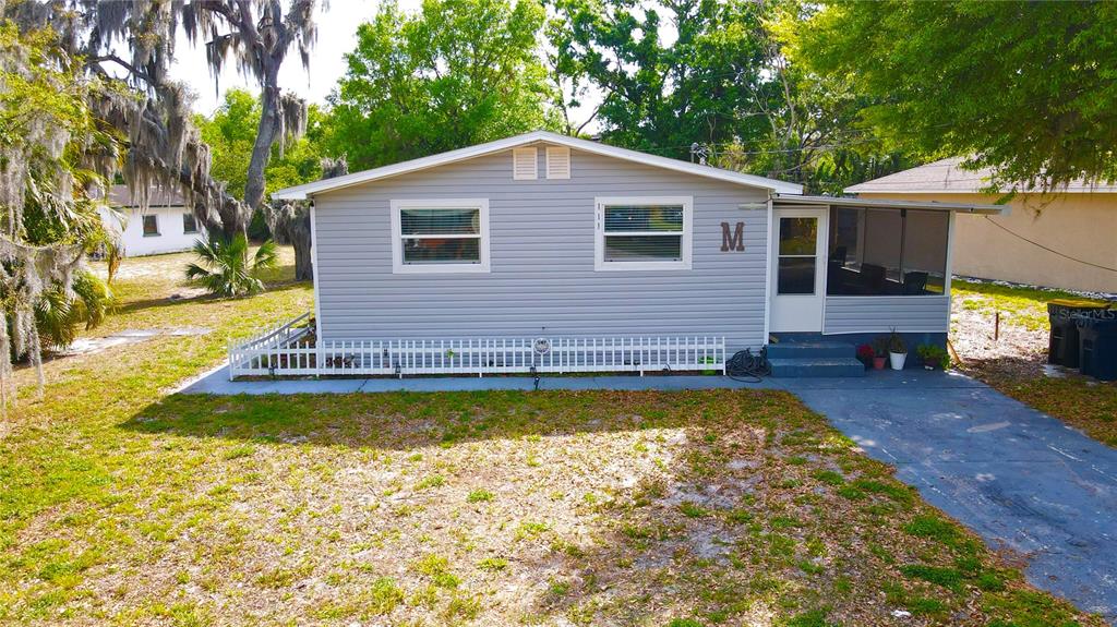 111 Palencia Road Auburndale, FL 33823 - Photo 2 of 28 a view of a house with swimming pool and sitting area