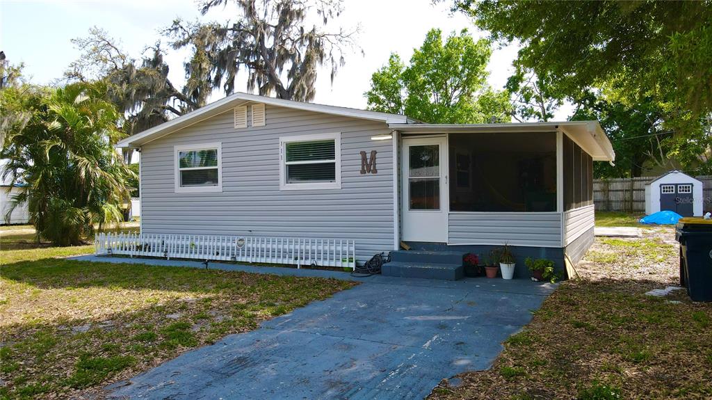 111 Palencia Road Auburndale, FL 33823 - Photo 23 of 28 a view of a house with a yard