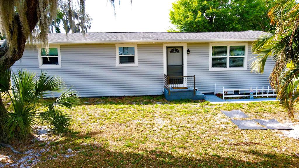 111 Palencia Road Auburndale, FL 33823 - Photo 25 of 28 a view of a house with a yard