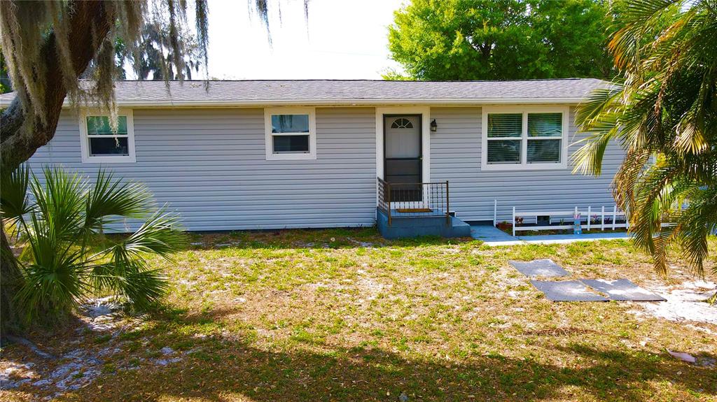 111 Palencia Road Auburndale, FL 33823 - Photo 26 of 28 a view of a house with a yard