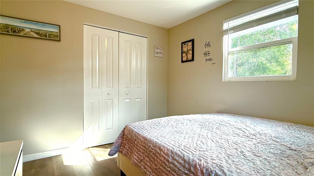 111 Palencia Road Auburndale, FL 33823 - Photo 8 of 28 a bedroom with a bed and wooden floor