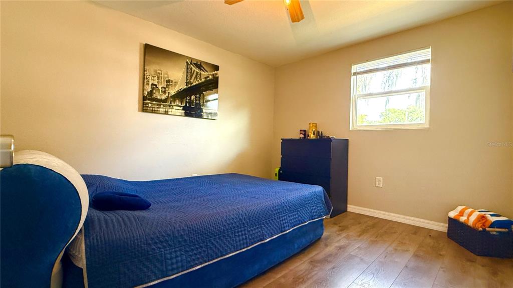111 Palencia Road Auburndale, FL 33823 - Photo 10 of 28 a bedroom with a bed and a window