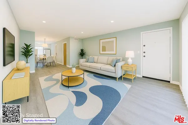 a living room with furniture and a table