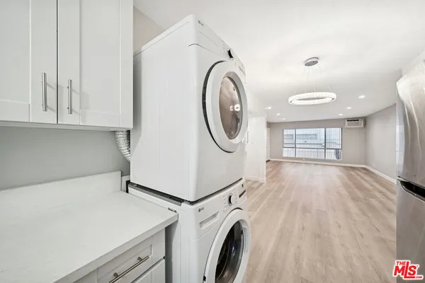 a view of a storage & utility room with washer and dryer
