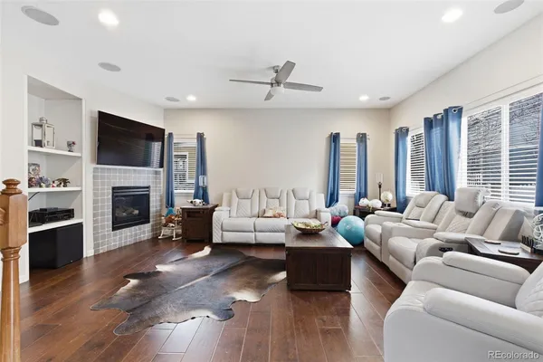 a living room with furniture fireplace and a flat screen tv