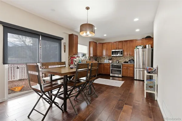 a view of a dining room with furniture window and wooden floor