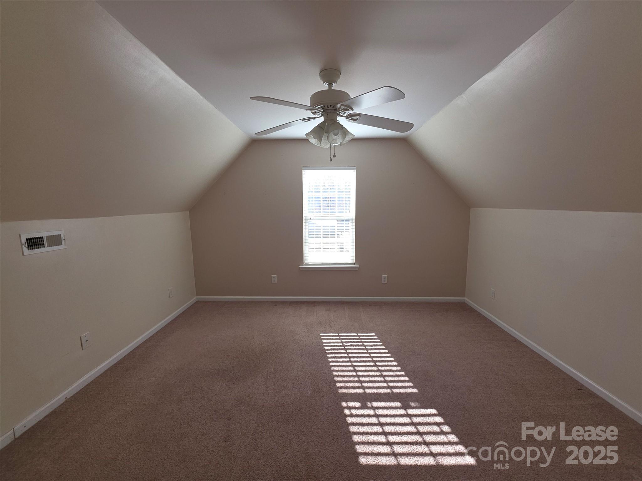 1682 Lane Road Mount Holly, NC 28120 - Photo 18 of 32 an empty room with windows and fan