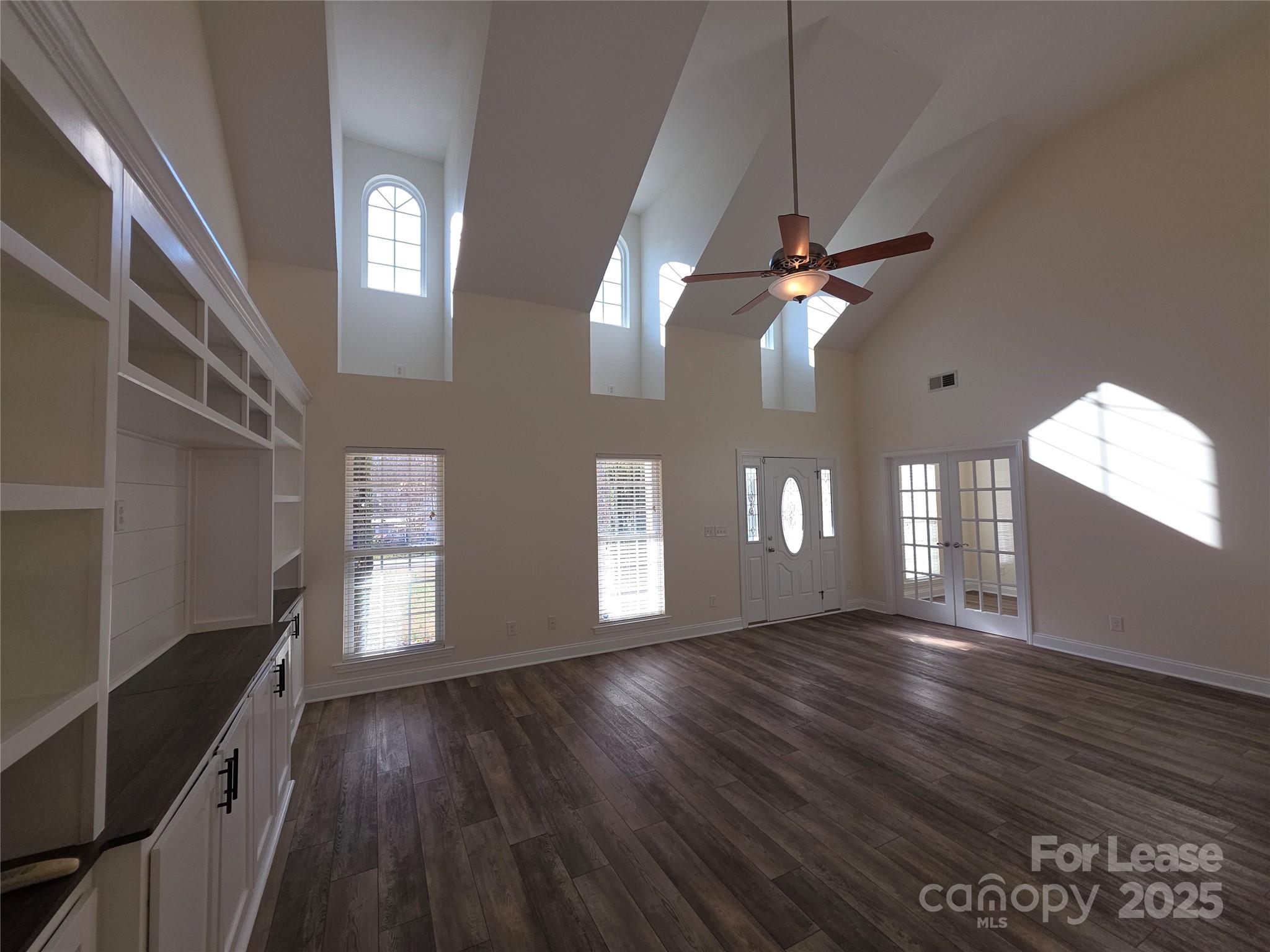 1682 Lane Road Mount Holly, NC 28120 - Photo 2 of 32 a view of an empty room with window and wooden floor