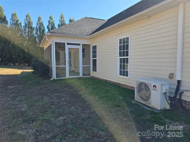 a view of backyard with deck and outdoor seating
