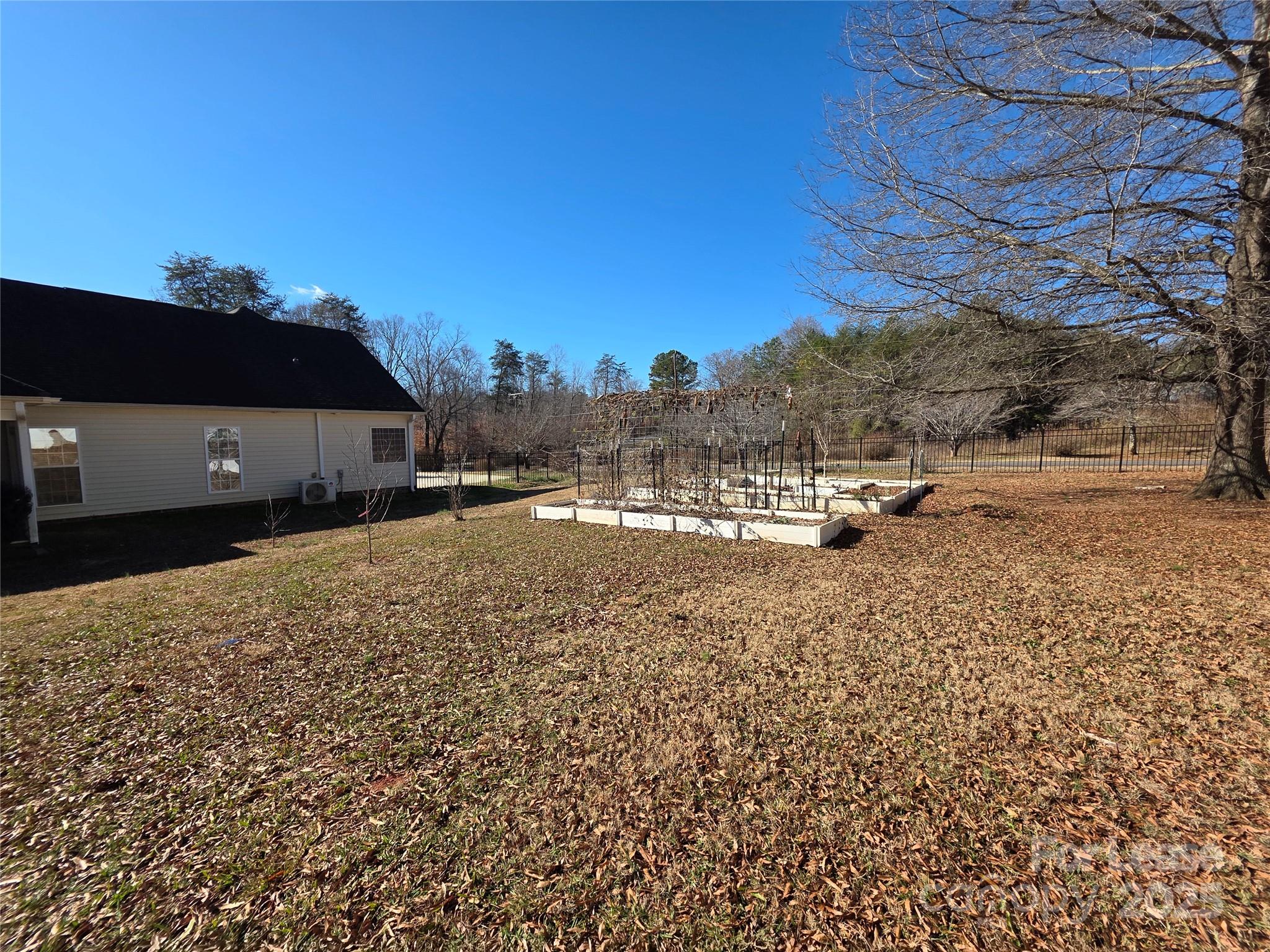 1682 Lane Road Mount Holly, NC 28120 - Photo 31 of 32 a view of the house with a yard