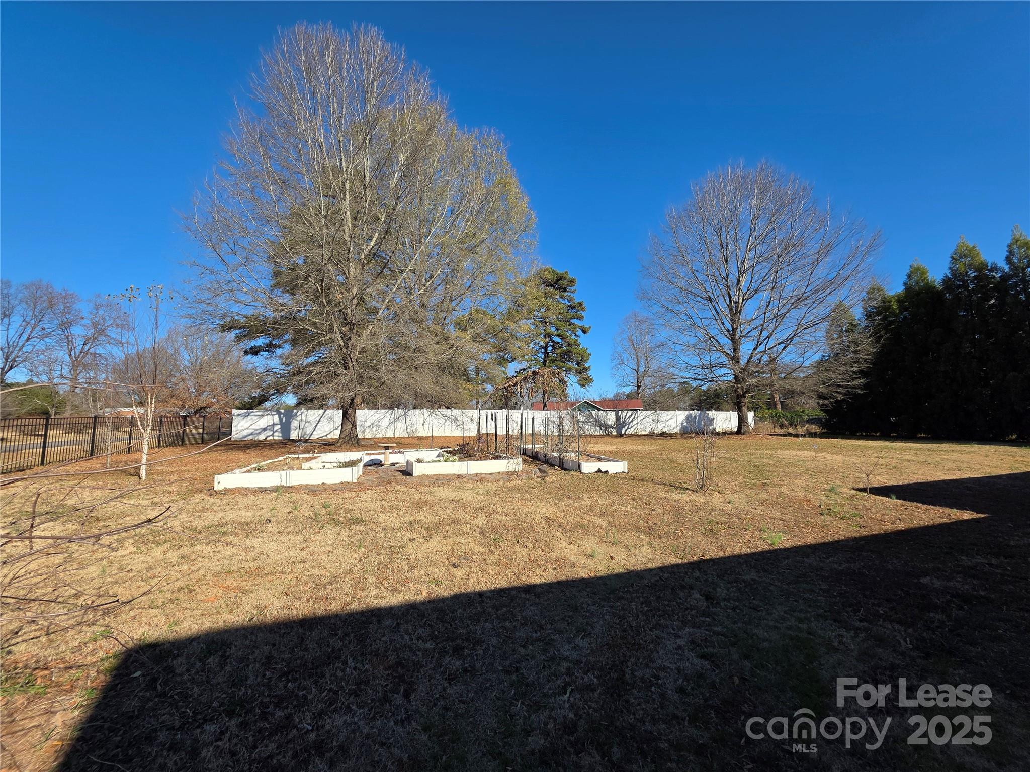 1682 Lane Road Mount Holly, NC 28120 - Photo 32 of 32 a view of yard with large trees