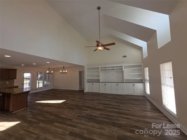 a view of a livingroom with a kitchen