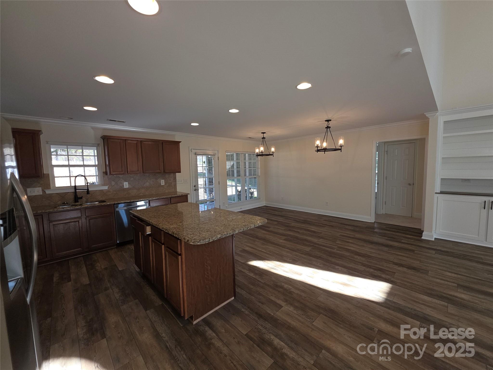 1682 Lane Road Mount Holly, NC 28120 - Photo 5 of 32 a kitchen with granite countertop lots of counter top space and stainless steel appliances