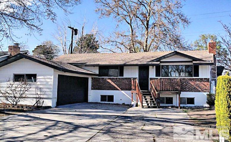 1901 Carlin Street Reno, NV 89503 - Photo 1 of 10 a front view of a house with garage
