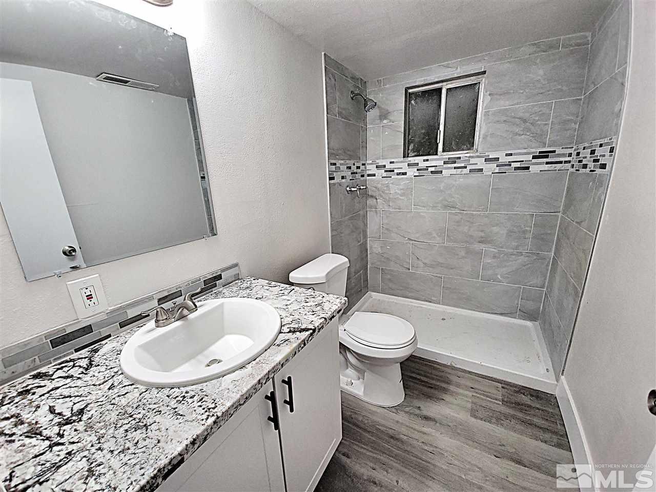 1901 Carlin Street Reno, NV 89503 - Photo 5 of 10 a bathroom with a sink toilet and shower