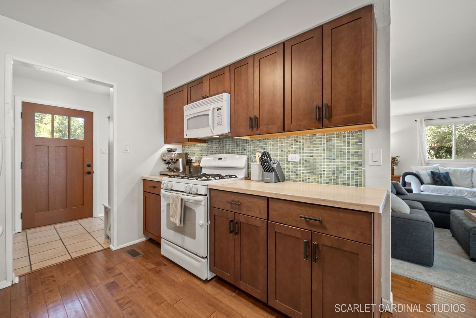 1215 Windsor Drive Wheaton, IL 60189 - Photo 12 of 32 a kitchen with stainless steel appliances granite countertop wooden cabinets a sink and dishwasher with wooden floor